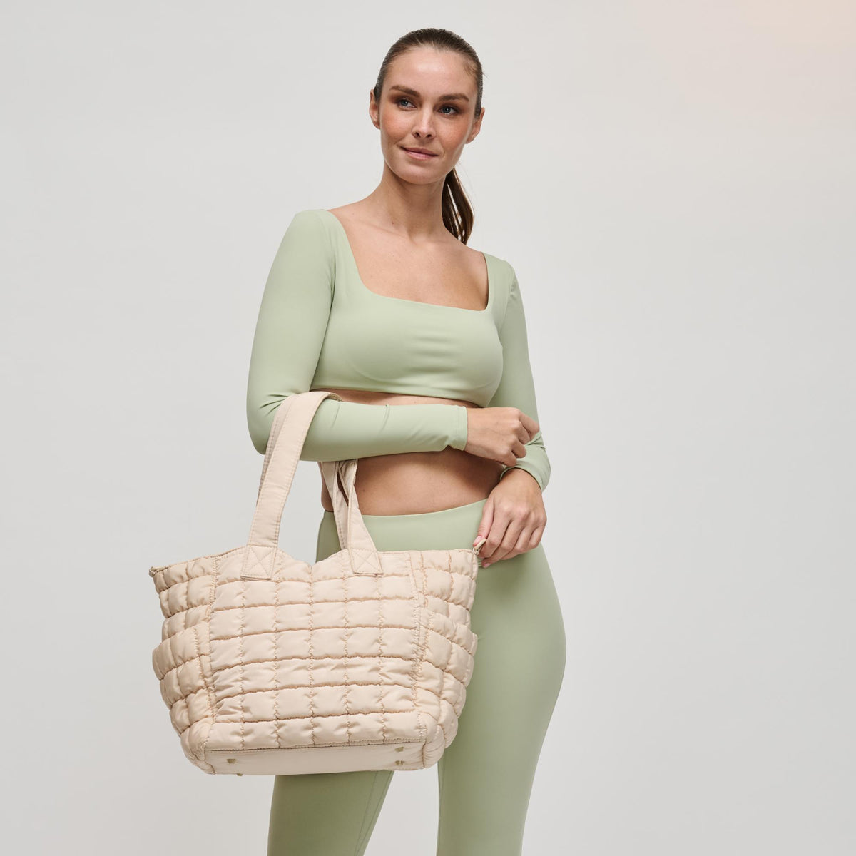 Woman wearing Cream Sol and Selene Dreamer Tote 841764109451 View 1 | Cream