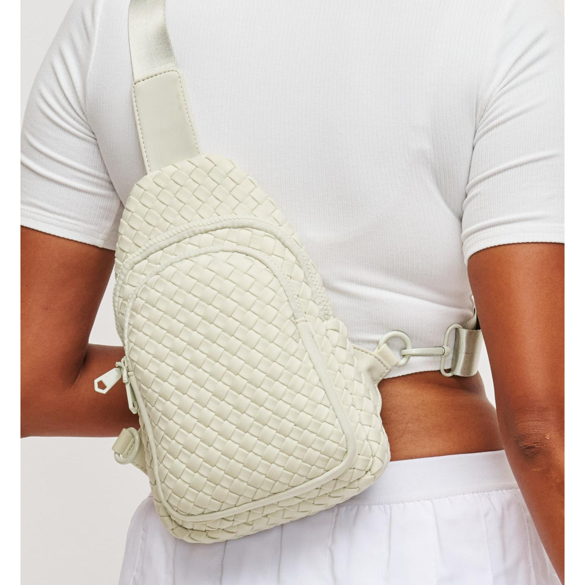 Woman wearing Bone Sol and Selene Beyond The Horizon - Woven Neoprene Sling Backpack 841764109062 View 1 | Bone