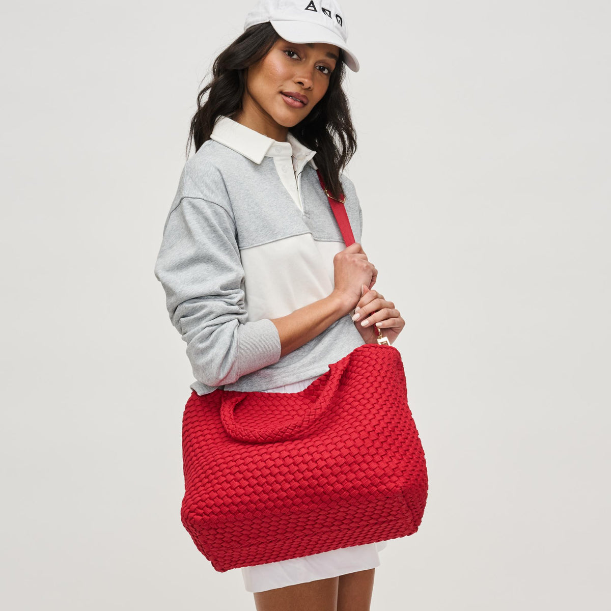 Woman wearing Red Sol and Selene Sky's The Limit - Medium Laced Up Eco-Edition Tote 841764111645 View 3 | Red