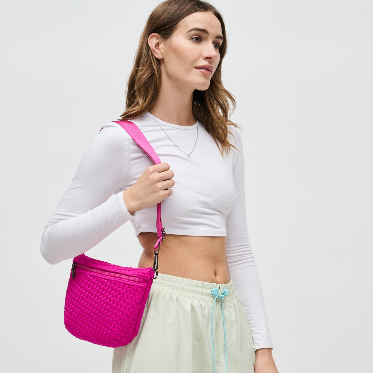 Woman wearing Fuchsia Sol and Selene Ethereal - Woven Neoprene Crossbody 841764110860 View 2 | Fuchsia