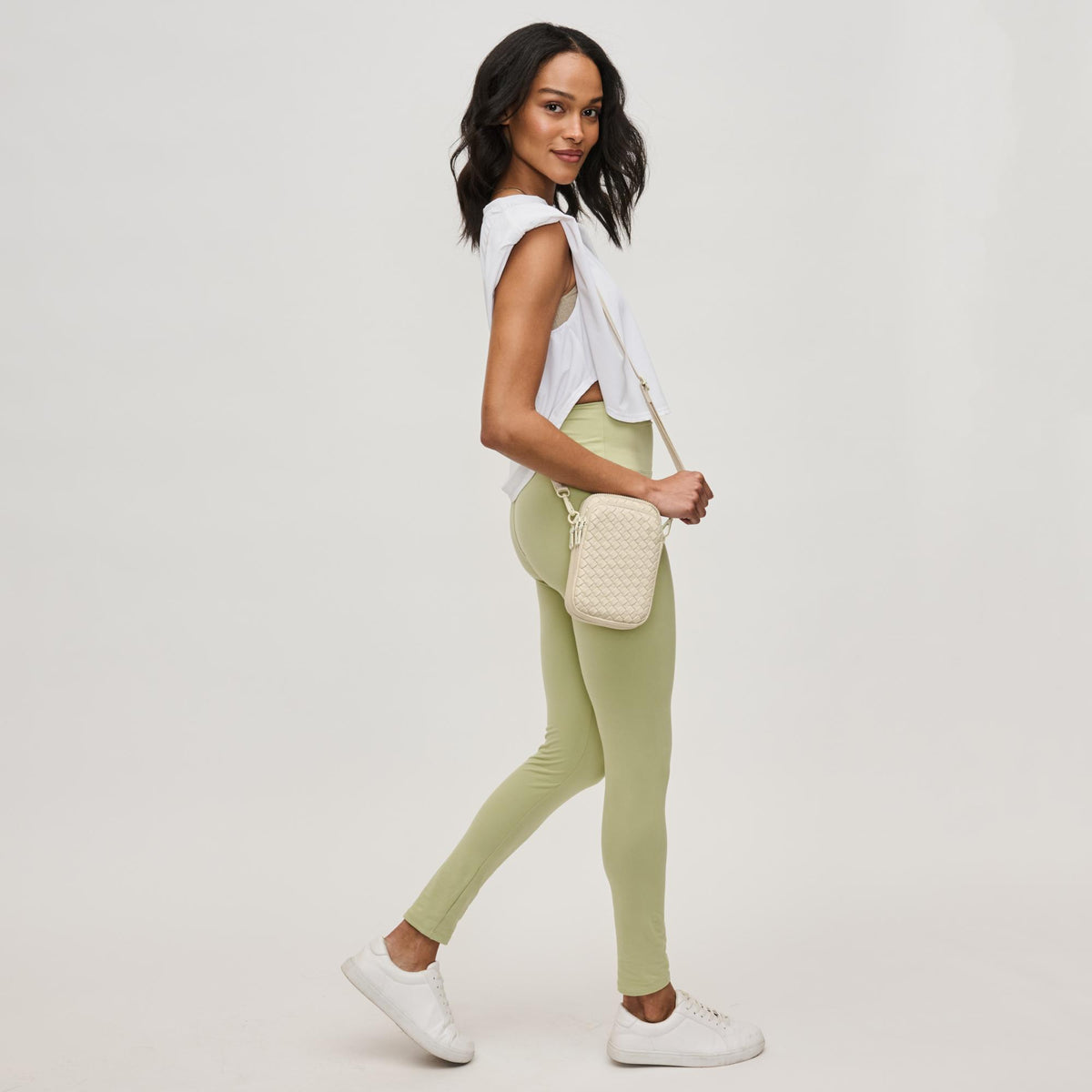 Woman wearing Cream Sol and Selene Divide & Conquer - Woven Neoprene Crossbody 841764109239 View 3 | Cream