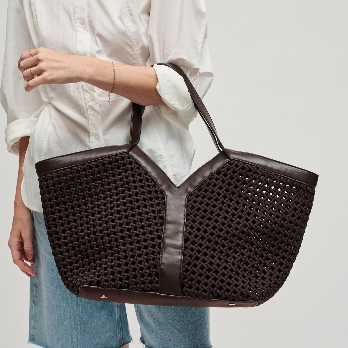 Woman wearing Chocolate Sol and Selene Calypso Tote 841764112918 View 1 | Chocolate