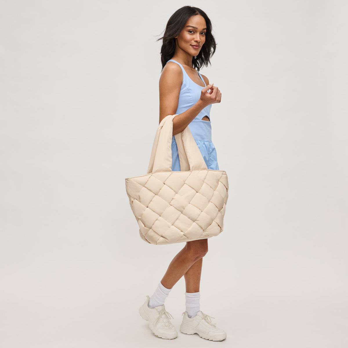Woman wearing Cream Sol and Selene Intuition East West Tote 841764111843 View 4 | Cream