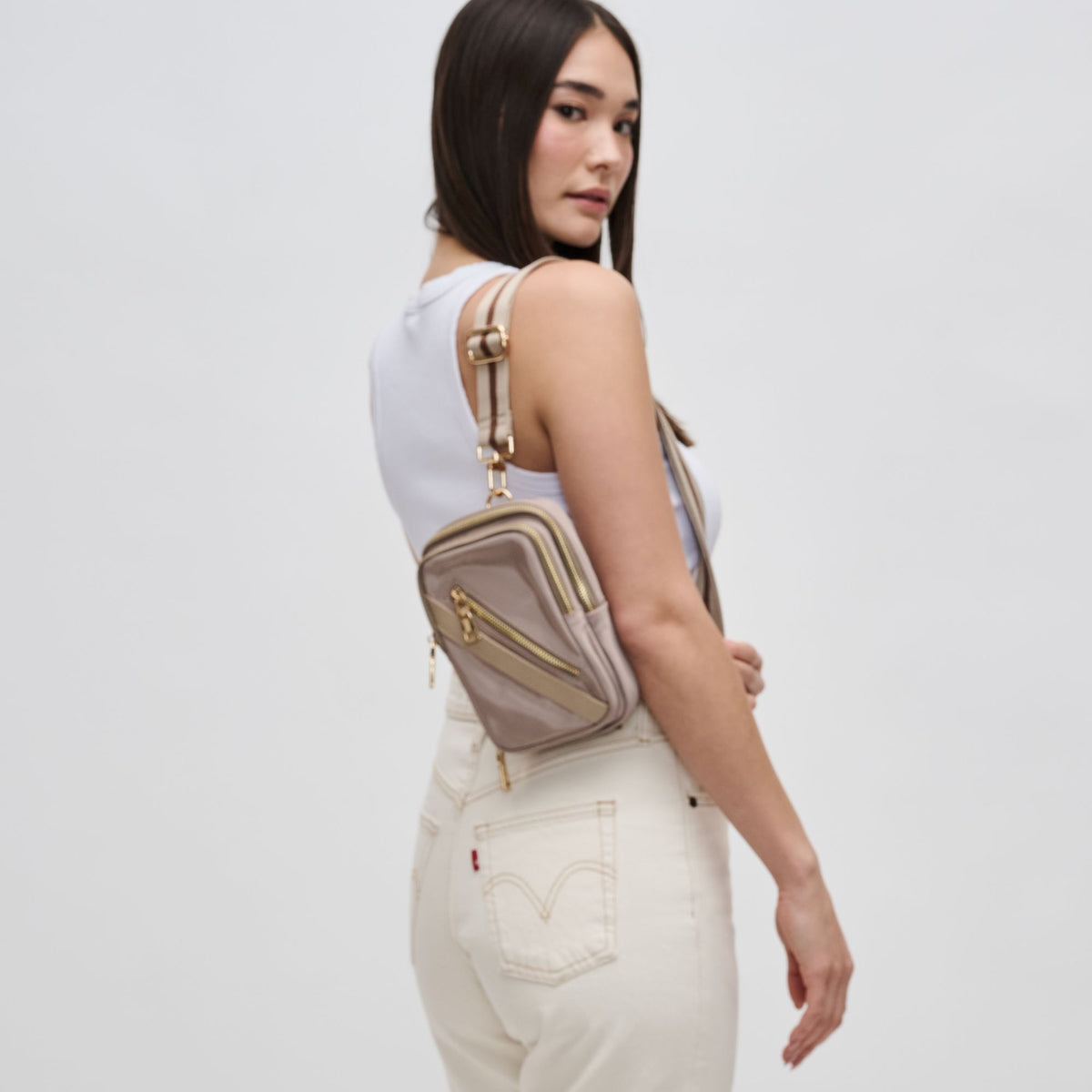 Woman wearing Nude Sol and Selene Accolade Sling Backpack 841764107495 View 2 | Nude