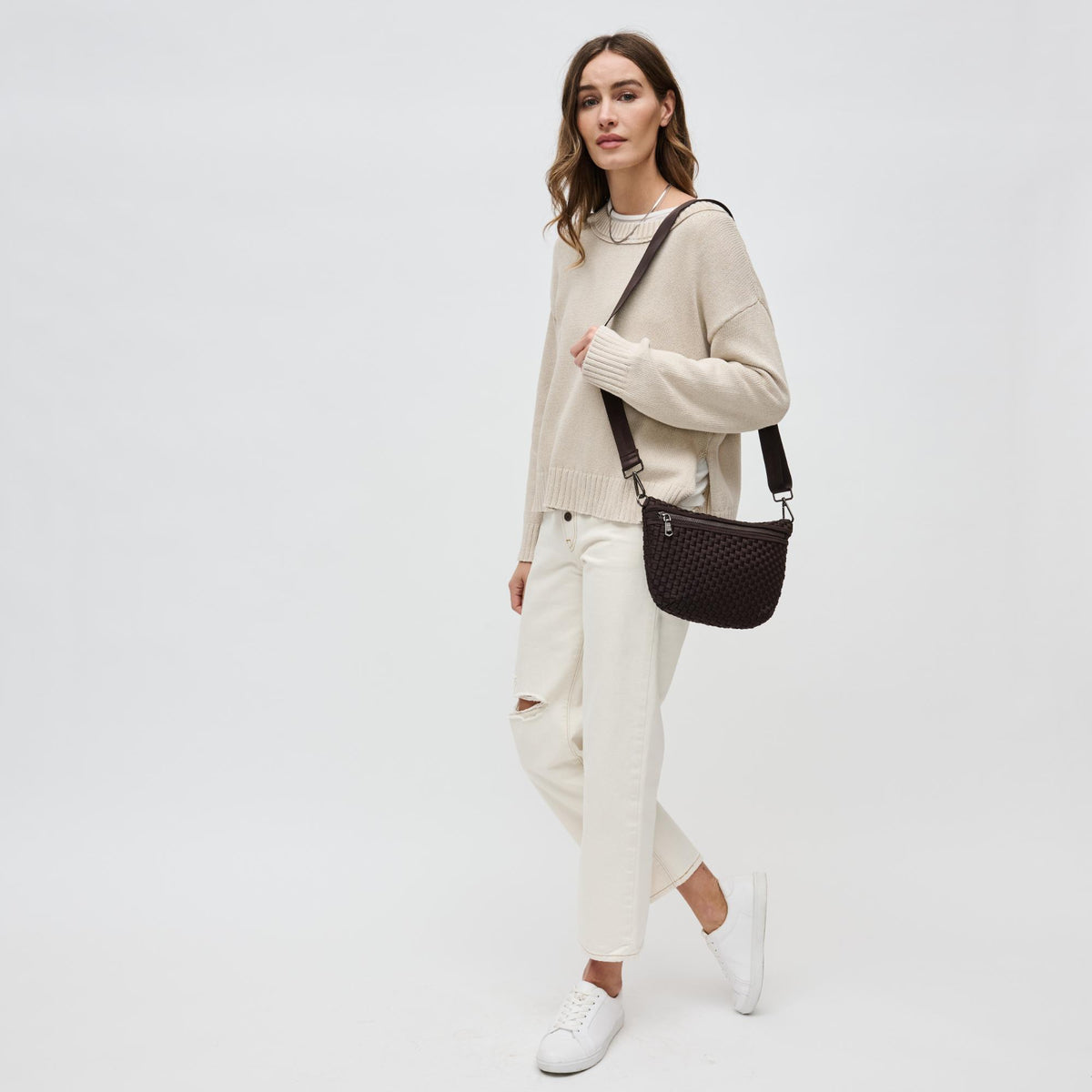 Woman wearing Chocolate Sol and Selene Ethereal - Woven Neoprene Crossbody 841764110853 View 3 | Chocolate