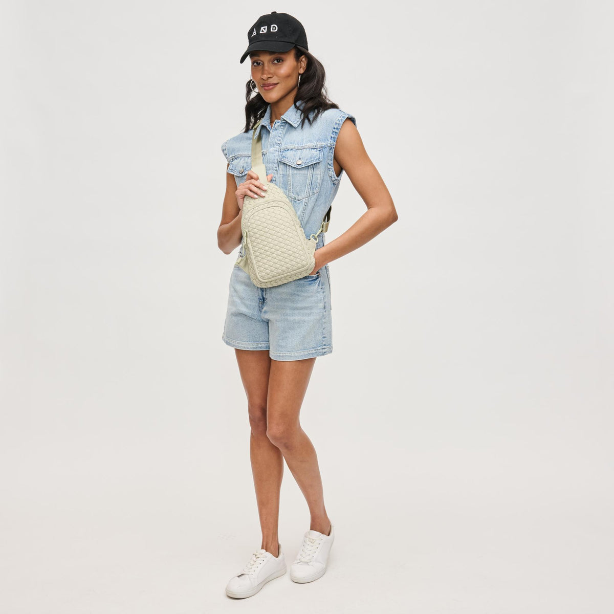 Woman wearing Sage Sol and Selene Beyond The Horizon - Woven Neoprene Sling Backpack 841764109086 View 4 | Sage