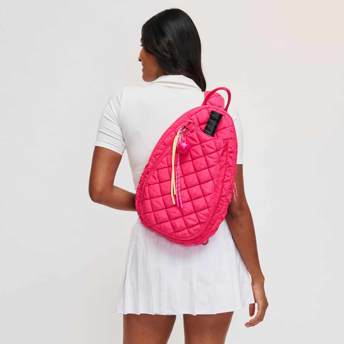 Woman wearing Hot Pink Sol and Selene Match Point - Quilted Puffer Pickleball & Paddle Tennis Sling Backpack 841764111997 View 2 | Hot Pink