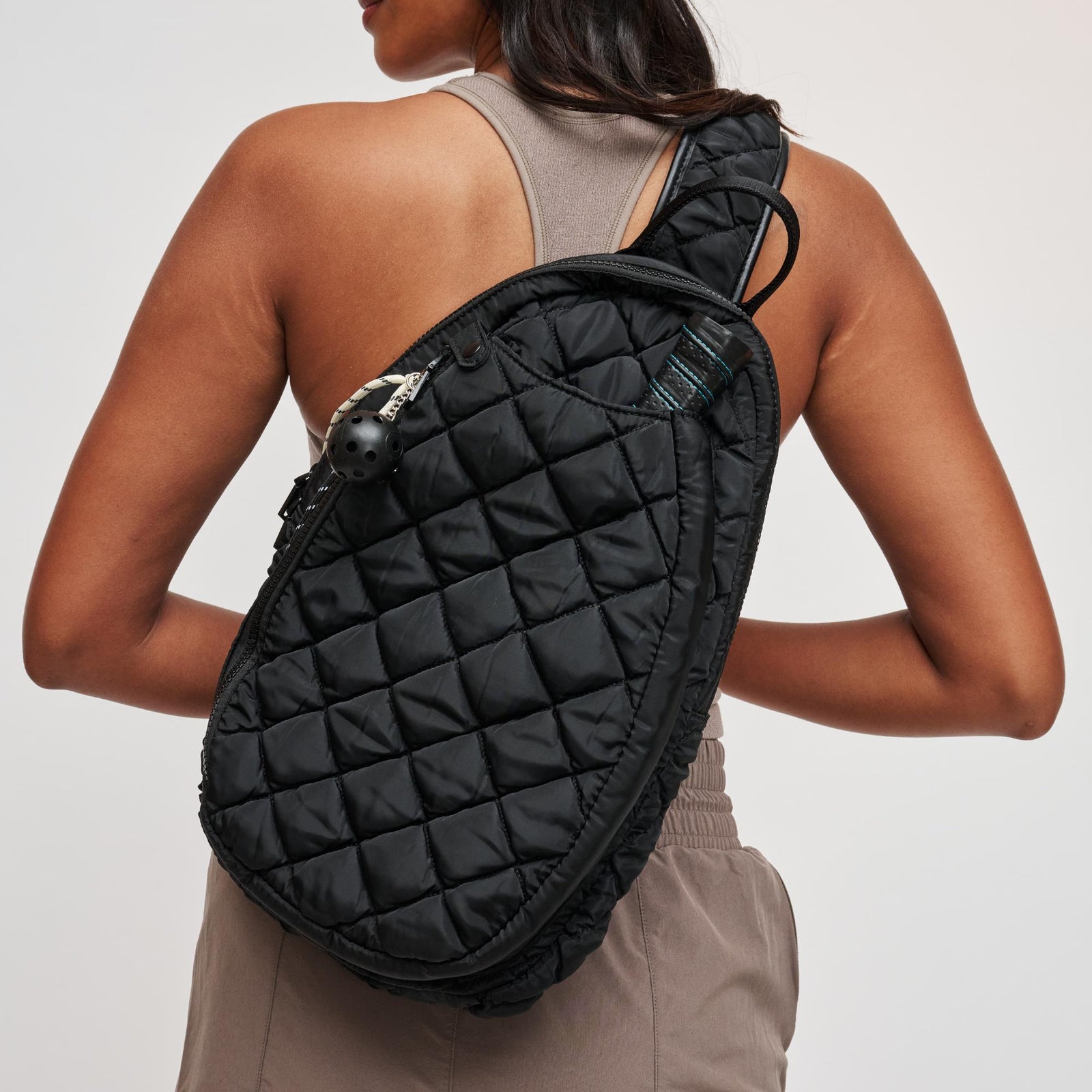 Woman wearing Black Sol and Selene Match Point - Quilted Puffer Pickleball & Paddle Tennis Sling Backpack 841764111973 View 1 | Black