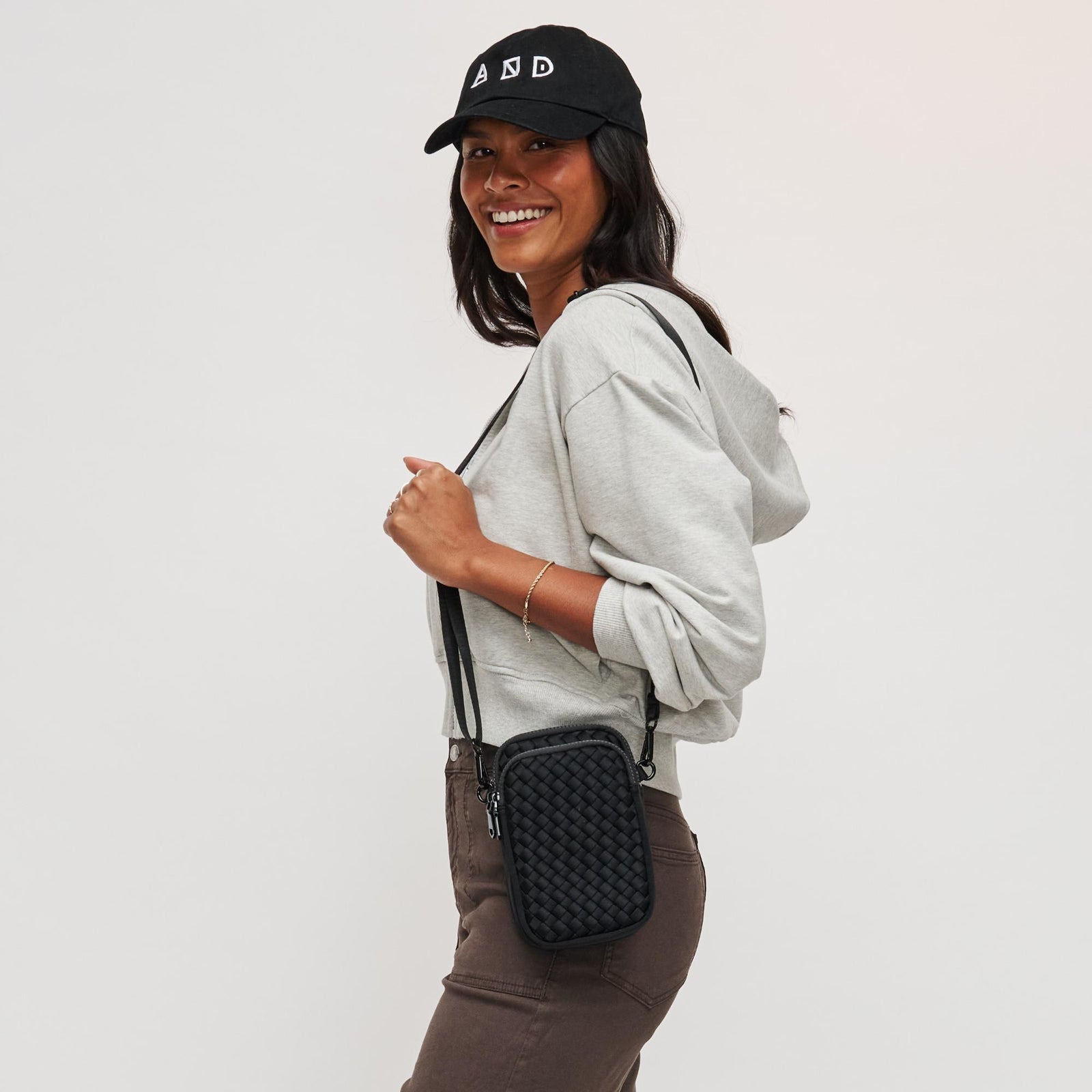 Woman wearing Black Sol and Selene Divide & Conquer - Woven Neoprene Crossbody 841764108706 View 1 | Black