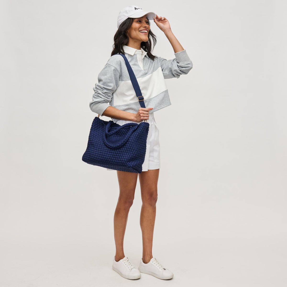 Woman wearing Navy Sol and Selene Sky's The Limit - Medium Laced Up Eco-Edition Tote 841764111614 View 4 | Navy