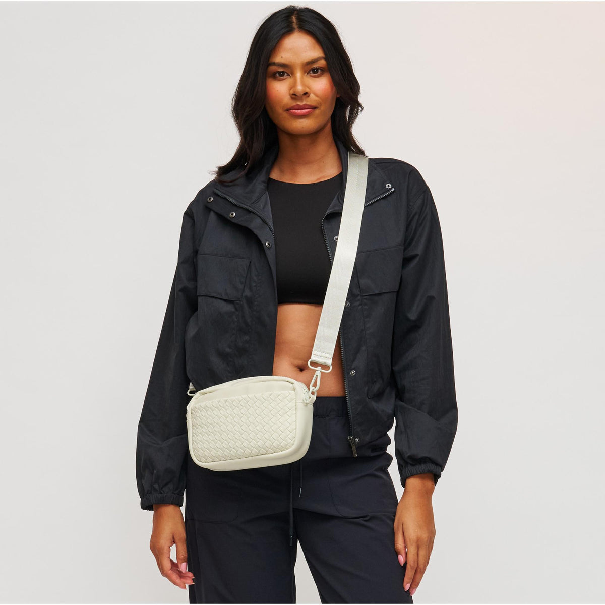 Woman wearing Bone Sol and Selene Inspiration - Woven Neoprene Crossbody 841764109215 View 1 | Bone