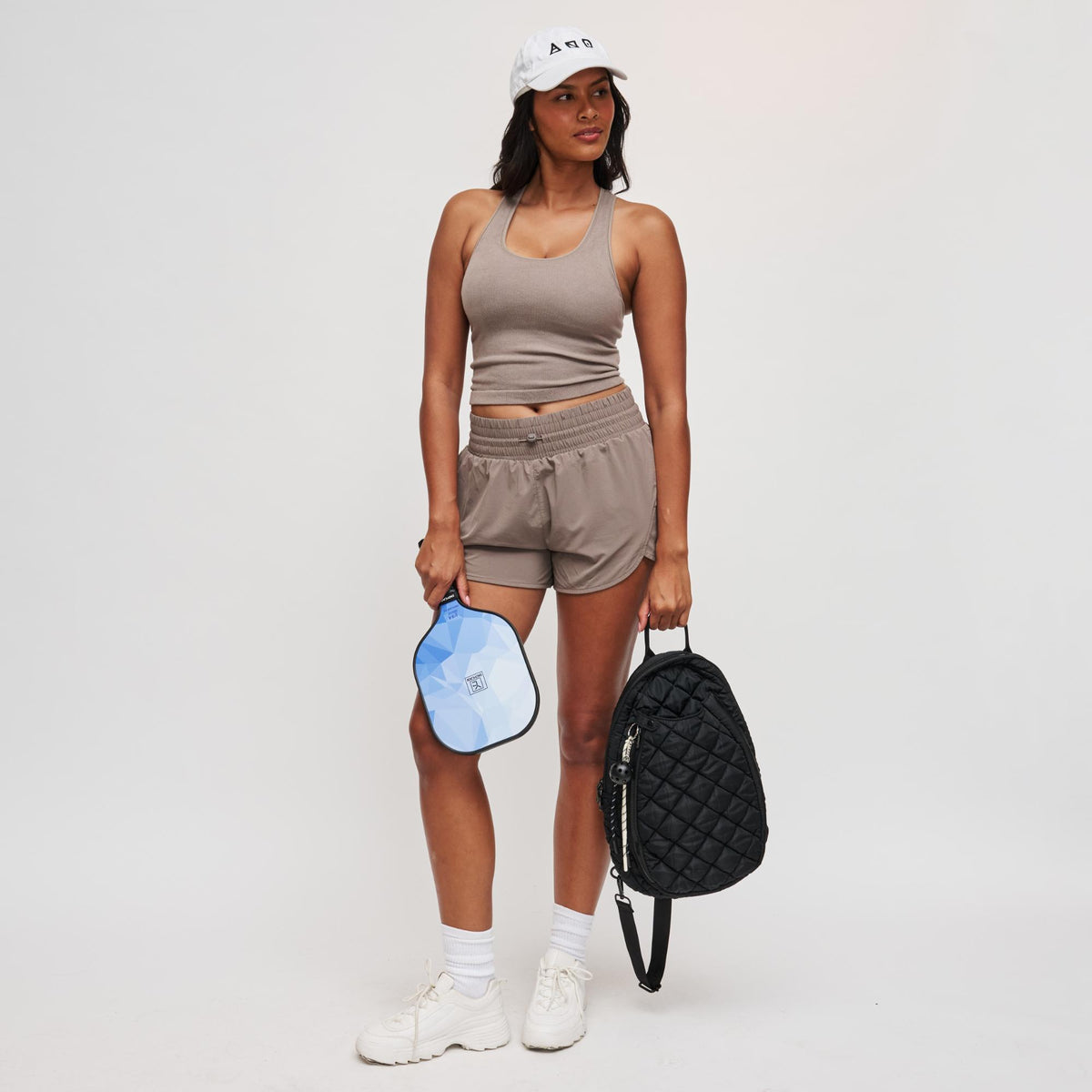 Woman wearing Black Sol and Selene Match Point - Quilted Puffer Pickleball & Paddle Tennis Sling Backpack 841764111973 View 3 | Black
