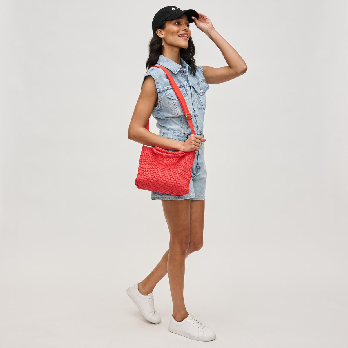 Woman wearing Coral Sol and Selene Sky's The Limit - Small Laced Up Eco-Edition Crossbody 841764111713 View 4 | Coral