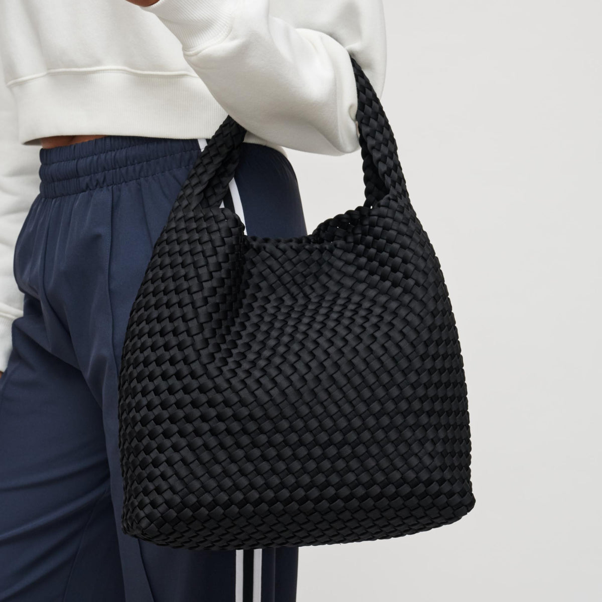 Woman wearing Black Sol and Selene Celestial Woven Neoprene Hobo 841764111201 View 4 | Black