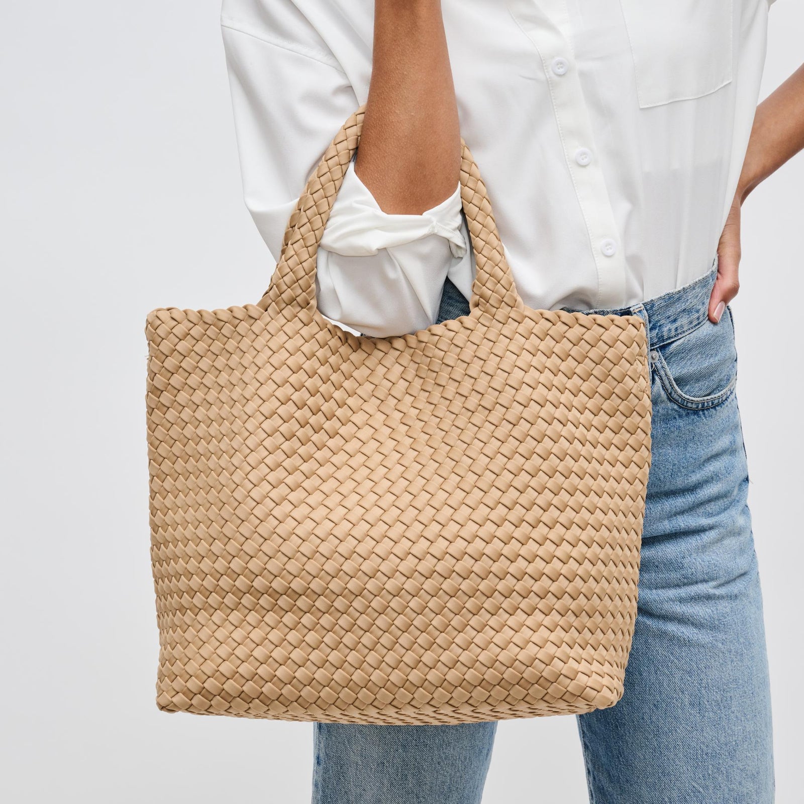 nude tote bag on a woman’s arm