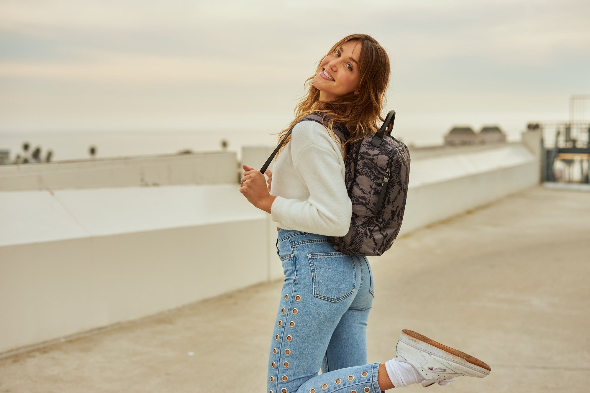 model wearing a Sol and Selene backpack