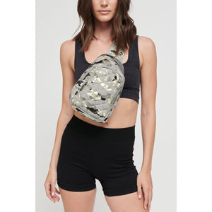 Woman wearing Seafoam Metallic Camo Sol and Selene On The Run Sling Backpack 841764105453 View 2 | Seafoam Metallic Camo