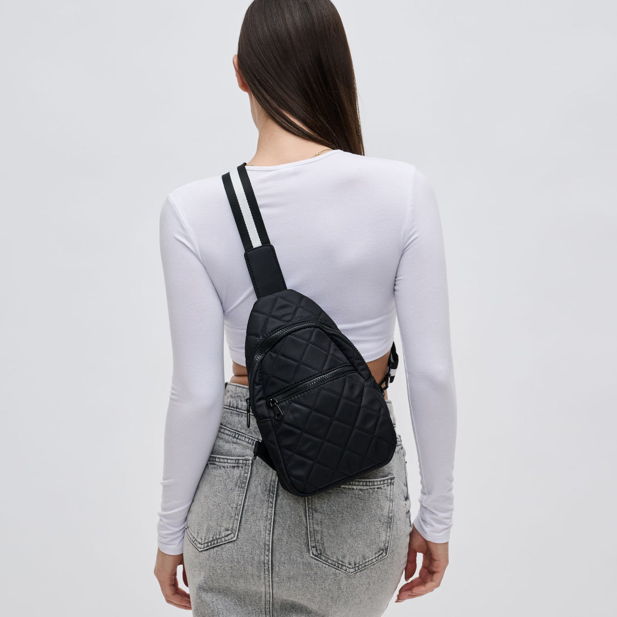 Woman wearing Black Sol and Selene Motivator Sling Backpack 841764106856 View 2 | Black