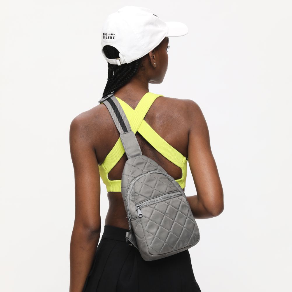 Woman wearing Carbon Sol and Selene Motivator Sling Backpack 841764107914 View 4 | Carbon