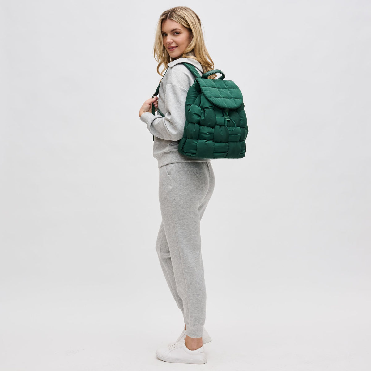 Woman wearing Emerald Sol and Selene Perception Backpack 841764107761 View 3 | Emerald