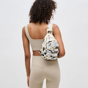 Woman wearing White Metallic Camo Sol and Selene On The Run Sling Backpack 841764106290 View 3 | White Metallic Camo