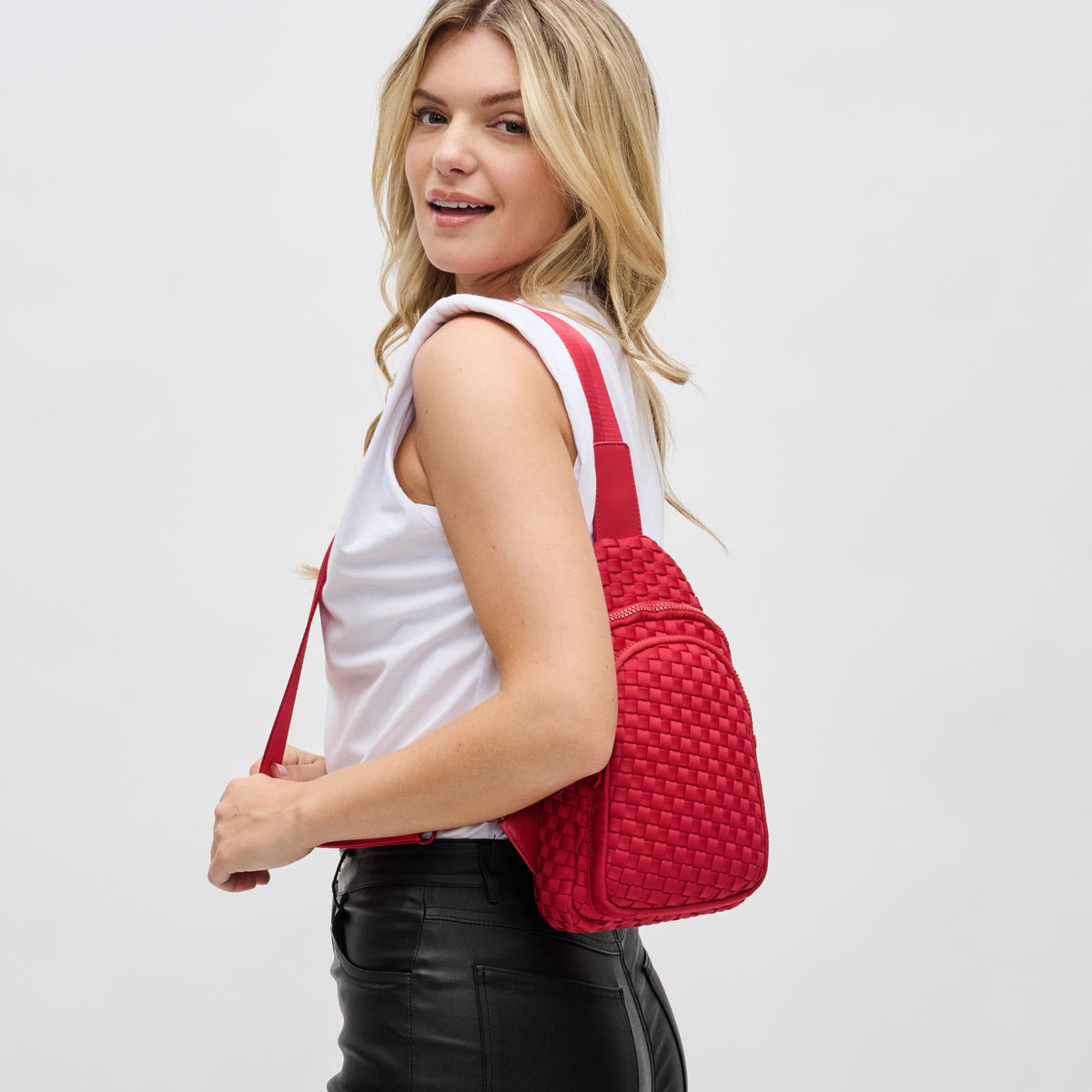 Woman wearing Red Sol and Selene Beyond The Horizon - Woven Neoprene Sling Backpack 841764108072 View 2 | Red