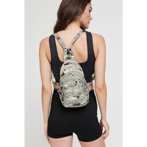 Woman wearing Seafoam Metallic Camo Sol and Selene On The Run Sling Backpack 841764105453 View 1 | Seafoam Metallic Camo