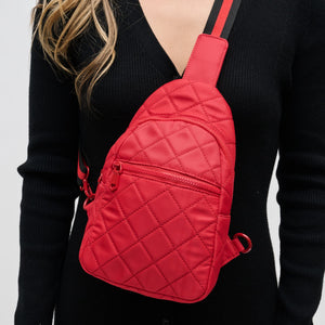 Woman wearing Red Sol and Selene Motivator Sling Backpack 841764107938 View 4 | Red